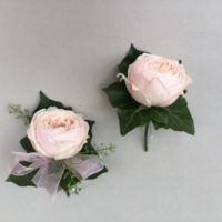 Pink rose ladies and gents buttonholes